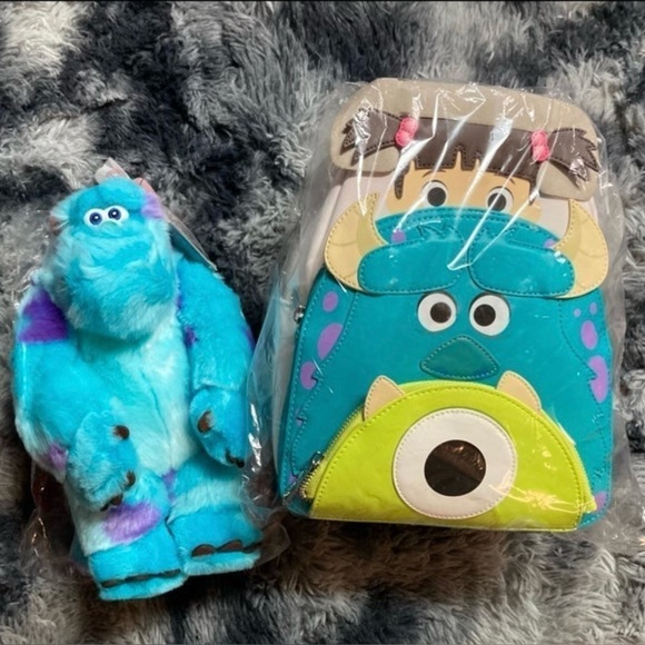 Loungefly Handbags - Loungefly Disney Pixar
Monsters Inc. Backpack & Sulley Plush